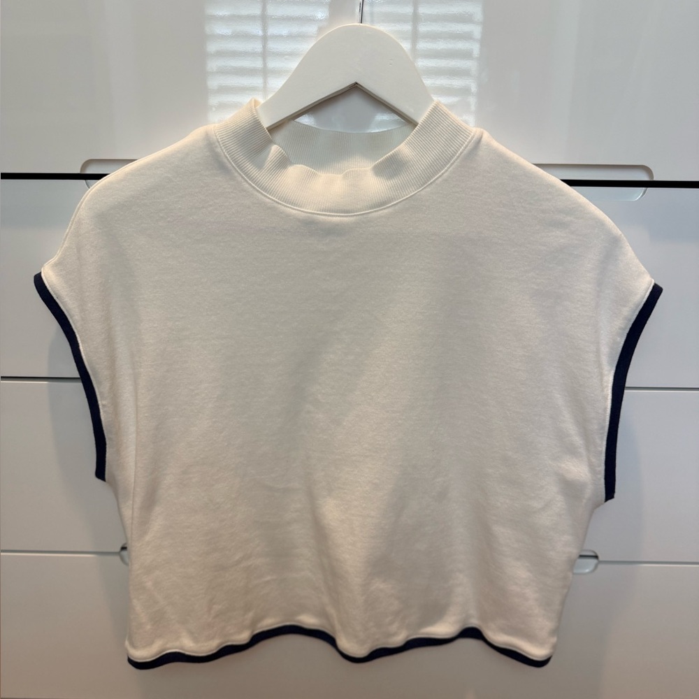 White Sleeveless Top with Black Trim